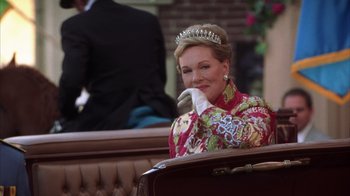 Movie still from “The Princess Diaries 2: Royal Engagement” (2004), directed by Garry Marshall – A woman wearing a tiara sitting on a bench; Medium shot, Over the shoulder angle