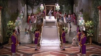 Movie still from “The Princess Diaries 2: Royal Engagement” (2004), directed by Garry Marshall – A group of people standing in front of a staircase; Extreme Wide shot, High angle