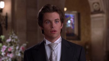 Movie still from “The Princess Diaries 2: Royal Engagement” (2004), directed by Garry Marshall – A man in a suit and a tie; Close Up shot, Over the shoulder angle