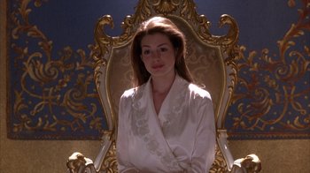 Movie still from “The Princess Diaries 2: Royal Engagement” (2004), directed by Garry Marshall – A woman sitting in an ornate chair wearing a white robe; Medium shot, High angle