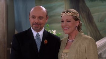 Movie still from “The Princess Diaries 2: Royal Engagement” (2004), directed by Garry Marshall – A man and a woman standing next to each other; Close Up shot, Low angle