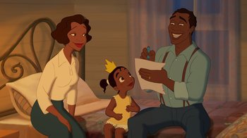 Movie still from “The Princess and the Frog” (2009), directed by Ron Clements – A couple of people that are sitting next to a little girl; Medium shot, High angle