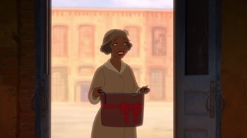 Movie still from “The Princess and the Frog” (2009), directed by Ron Clements – An animated woman is holding a gift box; Medium shot, Over the shoulder angle
