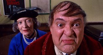 Movie still from “The Producers” (1967), directed by Mel Brooks – An older woman and a man with a surprised look on their faces; Close Up shot, Over the shoulder angle
