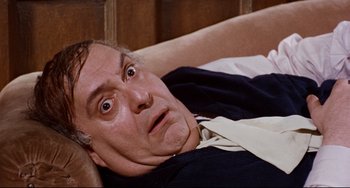 Movie still from “The Producers” (1967), directed by Mel Brooks – A man laying on a bed with his eyes wide open; Close Up shot, High angle