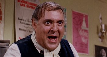 Movie still from “The Producers” (1967), directed by Mel Brooks – An older man with a surprised look on his face; Close Up shot, Low angle