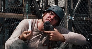 Movie still from “The Producers” (1967), directed by Mel Brooks – A baseball player holding a bat while wearing a helmet; Close Up shot, Low angle