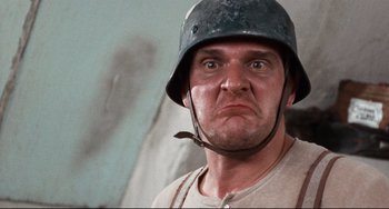 Movie still from “The Producers” (1967), directed by Mel Brooks – A person wearing a helmet; Close Up shot, Low angle