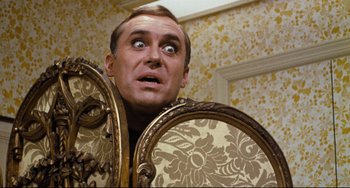 Movie still from “The Producers” (1967), directed by Mel Brooks – A person looking surprised in a room; Close Up shot, Overhead angle