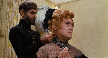 Movie still from “The Producers” (1967), directed by Mel Brooks – A man is getting his hair done by a woman; Close Up shot, Over the shoulder angle