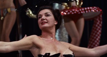Movie still from “The Producers” (1967), directed by Mel Brooks – A woman in a black dress is holding an umbrella; Close Up shot, Low angle