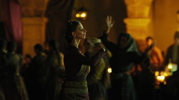 Movie still from “The Promise” (2016), directed by Terry George – A group of people dancing in a dark room; Medium shot, Low angle
