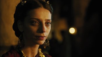 Movie still from “The Promise” (2016), directed by Terry George – A person wearing a necklace; Close Up shot, Over the shoulder angle