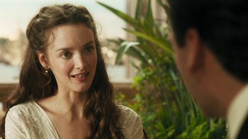 Movie still from “The Promise” (2016), directed by Terry George – A young woman is talking to a young man; Close Up shot, Over the shoulder angle