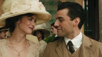 Movie still from “The Promise” (2016), directed by Terry George – A man and a woman wearing hats and a suit; Close Up shot, Over the shoulder angle