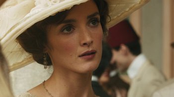 Movie still from “The Promise” (2016), directed by Terry George – A person wearing a hat; Close Up shot, Over the shoulder angle