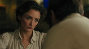 Movie still from “The Promise” (2016), directed by Terry George – A woman sitting in front of a man in front of a mirror; Close Up shot, Over the shoulder angle