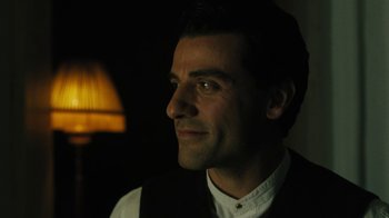 Movie still from “The Promise” (2016), directed by Terry George – A person wearing a suit and tie; Close Up shot, Over the shoulder angle