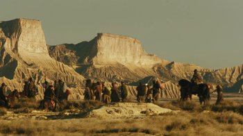 Movie still from “The Promise” (2016), directed by Terry George – A group of people standing on top of a hill; Extreme Wide shot, Low angle