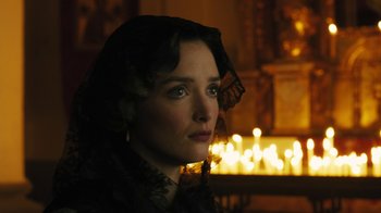 Movie still from “The Promise” (2016), directed by Terry George – A woman with a black veil on her head looking to her left; Close Up shot, Low angle