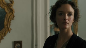 Movie still from “The Promise” (2016), directed by Terry George – A person wearing a black jacket; Close Up shot, Over the shoulder angle