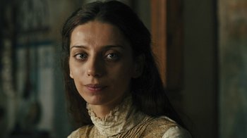 Movie still from “The Promise” (2016), directed by Terry George – A person with long hair; Close Up shot, Over the shoulder angle