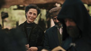 Movie still from “The Promise” (2016), directed by Terry George – A man and a woman standing next to each other; Medium shot, Over the shoulder angle