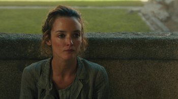 Movie still from “The Promise” (2016), directed by Terry George – A woman sitting on a bench in a park; Close Up shot, High angle