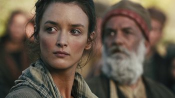 Movie still from “The Promise” (2016), directed by Terry George – A person wearing a plaid shirt; Close Up shot, Over the shoulder angle