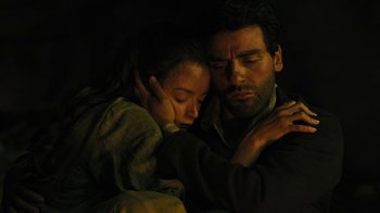 Movie still from “The Promise” (2016), directed by Terry George – A man and a woman embracing in the dark; Close Up shot, Low angle
