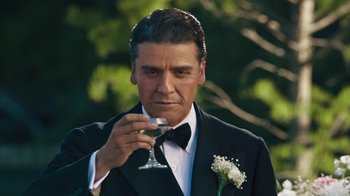 Movie still from “The Promise” (2016), directed by Terry George – A man in a tuxedo holding a wine glass; Close Up shot, Low angle