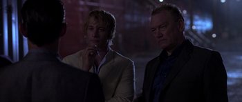 Movie still from “The Punisher” (2004), directed by Jonathan Hensleigh – A man and a woman standing next to each other; Close Up shot, Over the shoulder angle