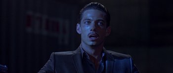 Movie still from “The Punisher” (2004), directed by Jonathan Hensleigh – A person wearing a suit and tie; Close Up shot, Low angle
