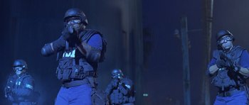Movie still from “The Punisher” (2004), directed by Jonathan Hensleigh – Two police officers in full body gear on a city street at night; Medium shot, Low angle