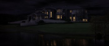 Movie still from “The Punisher” (2004), directed by Jonathan Hensleigh – A house with a pond in front of it at night time; Extreme Wide shot, Low angle
