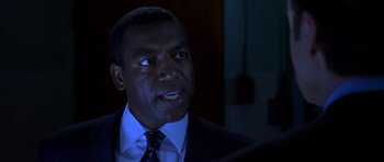 Movie still from “The Punisher” (2004), directed by Jonathan Hensleigh – A man in a suit and a tie; Close Up shot, Over the shoulder angle