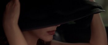 Movie still from “The Punisher” (2004), directed by Jonathan Hensleigh – A woman wearing a black hat; Extreme Close Up shot, Overhead angle