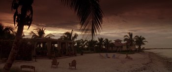 Movie still from “The Punisher” (2004), directed by Jonathan Hensleigh – A view of an empty beach at sunset; Extreme Wide shot, High angle