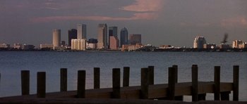 Movie still from “The Punisher” (2004), directed by Jonathan Hensleigh – A view of a city skyline from the water at dusk; Extreme Wide shot, Low angle
