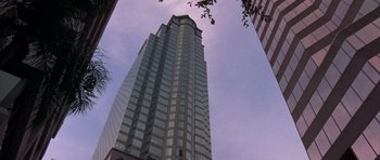 Movie still from “The Punisher” (2004), directed by Jonathan Hensleigh – Looking up at a skyscraper in the city; Extreme Wide shot, Low angle