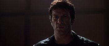 Movie still from “The Punisher” (2004), directed by Jonathan Hensleigh – A person wearing a black jacket; Close Up shot, Low angle