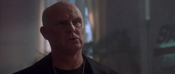 Movie still from “The Punisher” (2004), directed by Jonathan Hensleigh – A man with a bald head looking to his left; Close Up shot, Low angle