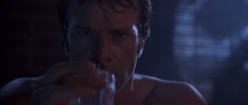 Movie still from “The Punisher” (2004), directed by Jonathan Hensleigh – A person drinking a glass of water; Close Up shot, Low angle