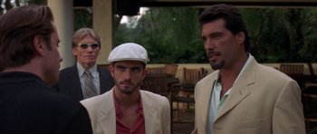 Movie still from “The Punisher” (2004), directed by Jonathan Hensleigh – A group of men standing next to each other on a deck; Close Up shot, Over the shoulder angle