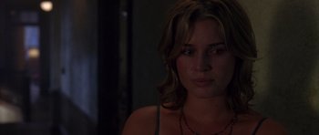 Movie still from “The Punisher” (2004), directed by Jonathan Hensleigh – A person wearing a necklace in the dark; Close Up shot, Over the shoulder angle