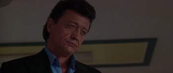 Movie still from “The Punisher” (2004), directed by Jonathan Hensleigh – A person wearing a suit and tie; Close Up shot, Low angle