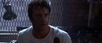 Movie still from “The Punisher” (2004), directed by Jonathan Hensleigh – A person wearing a white t - shirt; Close Up shot, Low angle
