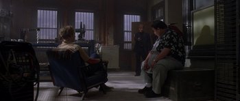 Movie still from “The Punisher” (2004), directed by Jonathan Hensleigh – A group of people sitting in a living room; Wide shot, Over the shoulder angle