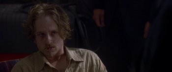 Movie still from “The Punisher” (2004), directed by Jonathan Hensleigh – A man with long blonde hair and blue eyes; Close Up shot, Over the shoulder angle