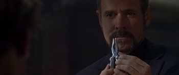 Movie still from “The Punisher” (2004), directed by Jonathan Hensleigh – A person holding a pliers; Close Up shot, Low angle
